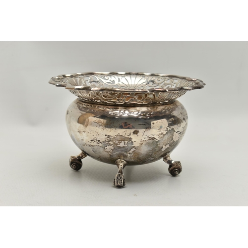 236 - A SILVER BONBON DISH, deep round bowl with a worn gilt interior, wavy open work rim, raised on four ... 