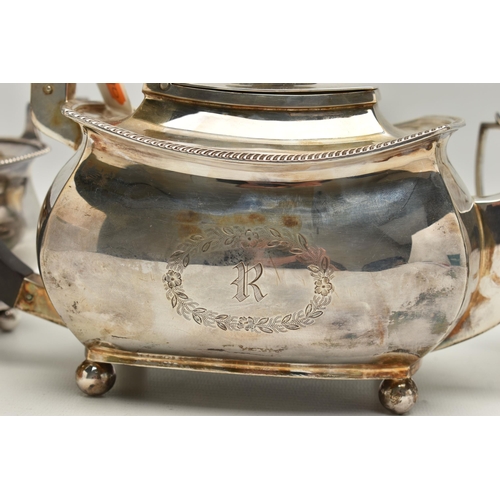 237 - A GEORGE V THREE PIECE SILVER TEA SET, comprising of a polished teapot with engraved initial 'R' in ... 