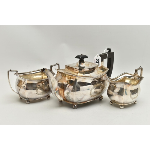 237 - A GEORGE V THREE PIECE SILVER TEA SET, comprising of a polished teapot with engraved initial 'R' in ... 