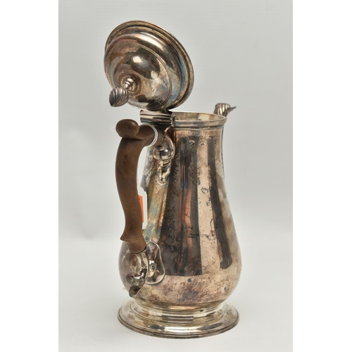 247 - A GEORGE II SILVER COFFEE POT, polished form, fitted with a light brown wooden scroll handle, shell ... 