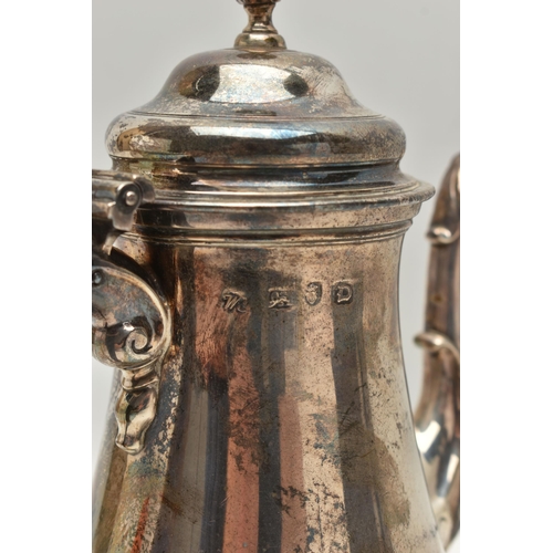 247 - A GEORGE II SILVER COFFEE POT, polished form, fitted with a light brown wooden scroll handle, shell ... 