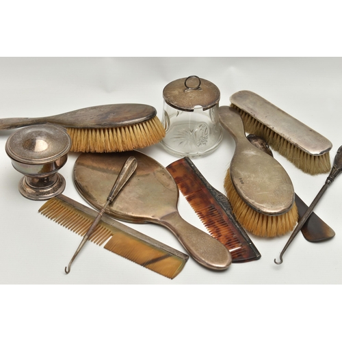 249 - A SELECTION OF SILVER VANITY ITEMS, to include a four piece, polished silver dressing table set, com... 