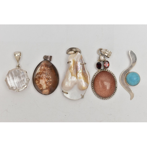 67 - FIVE STATEMENT PENDANTS, a selection of white metal pendants, set with pearl, shell, goldstone and i... 