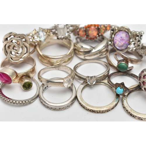 72 - AN ASSORTMENT OF WHITE METAL RINGS, twenty three rings of assorted designs, some stamped 925, approx... 