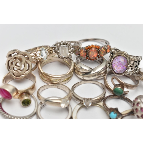 72 - AN ASSORTMENT OF WHITE METAL RINGS, twenty three rings of assorted designs, some stamped 925, approx... 