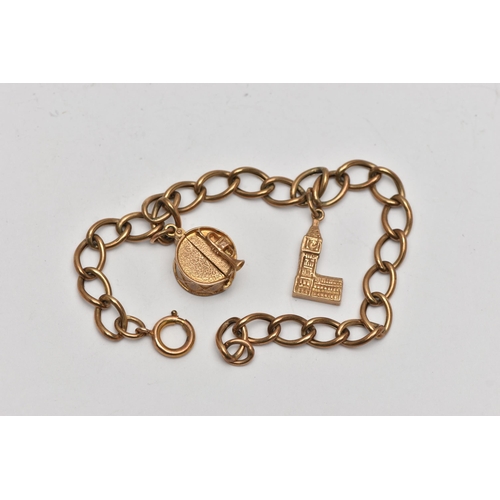 91 - A 9CT GOLD BRACELET AND TWO CHARMS, an oval link chain bracelet, approximate length 200mm, fitted wi... 