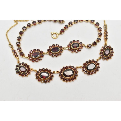 271 - A YELLOW METAL GARNET NECKLACE AND A BRACELET, the necklace fitted with five oval garnet cluster lin... 