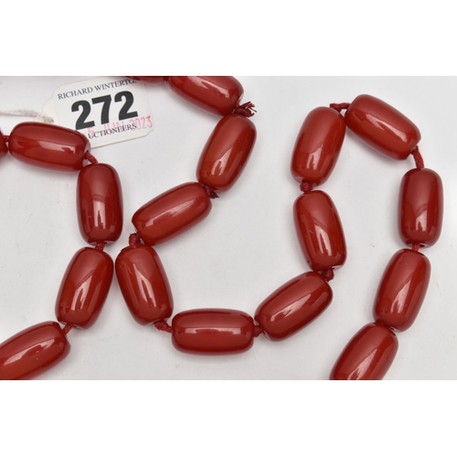 272 - A RED PLASTIC BARREL BEAD NECKLACE, designed with a single row of thirty-five barrel shape beads, ea... 