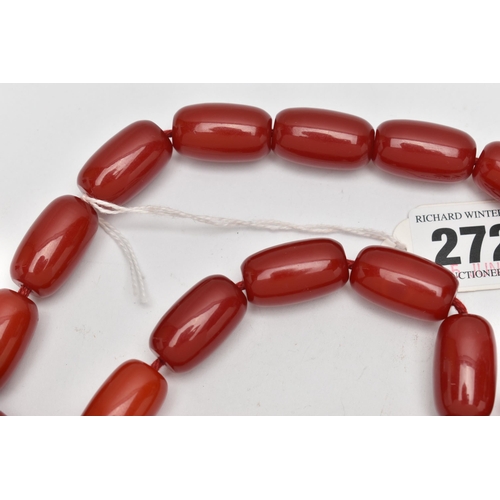 272 - A RED PLASTIC BARREL BEAD NECKLACE, designed with a single row of thirty-five barrel shape beads, ea... 