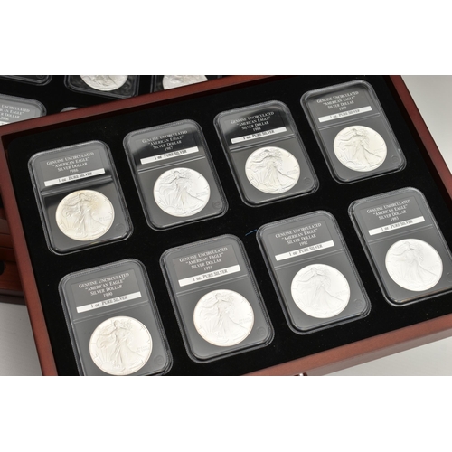 273 - A CASED SET OF 37 USA SILVER EAGLE COINS, each of the coins are individually slabbed and uncirculate... 