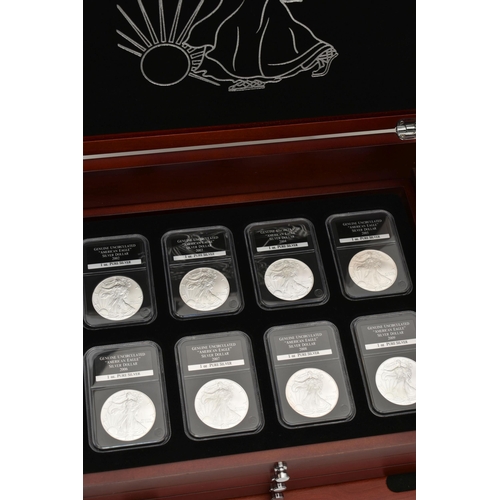 273 - A CASED SET OF 37 USA SILVER EAGLE COINS, each of the coins are individually slabbed and uncirculate... 