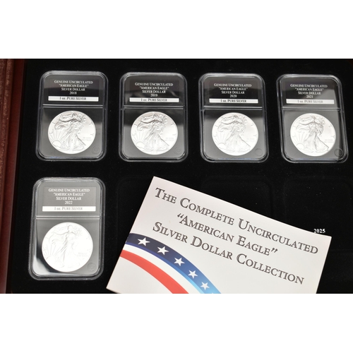 273 - A CASED SET OF 37 USA SILVER EAGLE COINS, each of the coins are individually slabbed and uncirculate... 