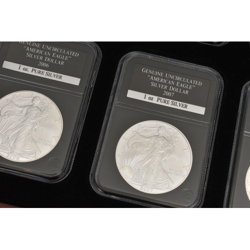 273 - A CASED SET OF 37 USA SILVER EAGLE COINS, each of the coins are individually slabbed and uncirculate... 