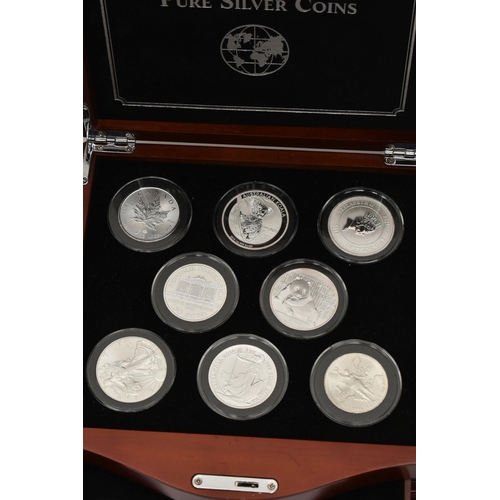 274 - A BOXED DISPLAY OF EIGHT BU PURE SILVER COINS, to include a Canada 0.999 Silver Maple 2015, an Austr... 