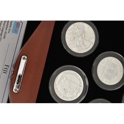 274 - A BOXED DISPLAY OF EIGHT BU PURE SILVER COINS, to include a Canada 0.999 Silver Maple 2015, an Austr... 