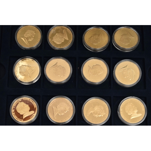 285 - A WESTMINSTER BOXED DISPLAY OF GOLD LAYERED COINS, to include 36x Cook Islands Dollar coins 1969-200... 