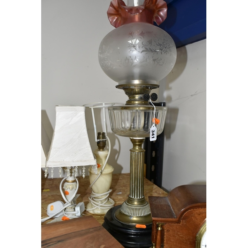 341 - A GROUP OF BEDSIDE LAMPS, WOODEN BOXES AND A MANTEL CLOCK, comprising a Victorian oil lamp with a br... 