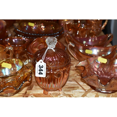 344 - A LARGE QUANTITY OF CARNIVAL GLASSWARE, traditional orange colour, comprising a preserve pot, three ... 