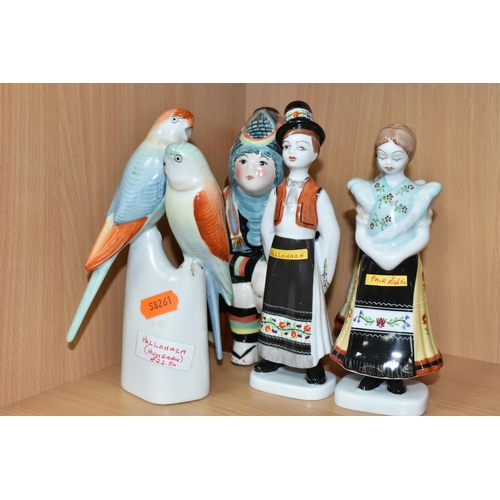 387 - A GROUP OF EASTERN EUROPEAN CERAMIC FIGURES, comprising a Hollohaza swan, a Hollohaza figure group o... 