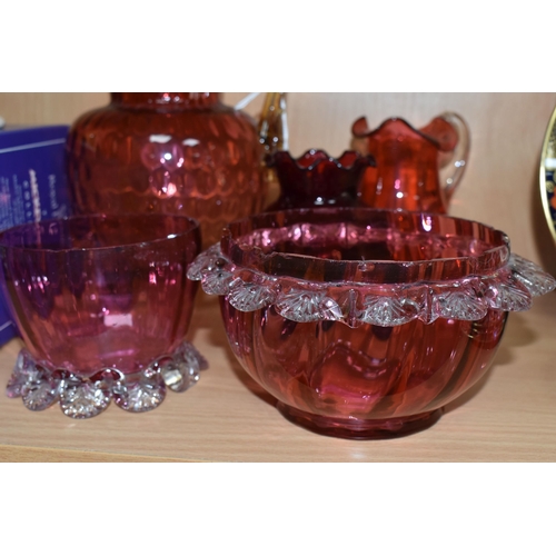 398 - A GROUP OF CRANBERRY GLASS, comprising a graduating clear to pink jug, with amber glass handle and t... 