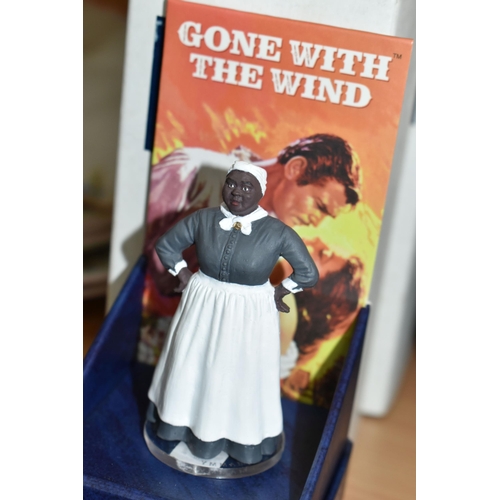 437 - A SET OF CORGI COLLECTABLE ICON FIGURES AND DISPLAY STAND, four boxed 'Gone With The Wind' figures c... 