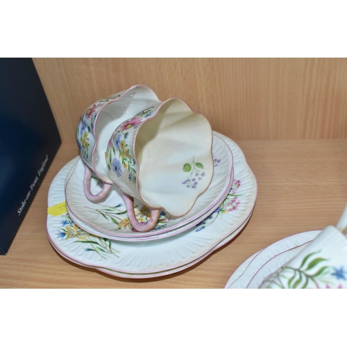 438 - A SHELLEY 'WILD FLOWERS' 13668 PATTERN TEA SET, pale pink handles and edges, comprising six cups, si... 