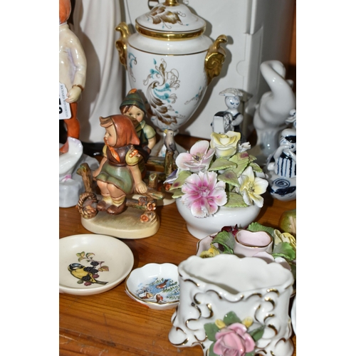 450 - A GROUP OF CERAMIC ORNAMENTS, comprising a Llado 4824  'Golfer' figure (missing golf club), a boxed ... 