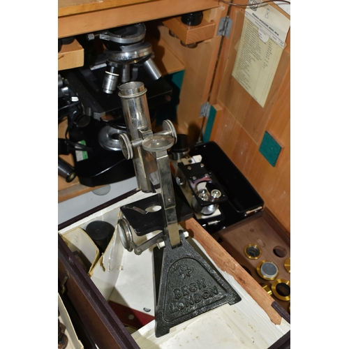 477 - FOUR VINTAGE MICROSCOPES, comprising a PZO Warszawa research microscope model MB 8 in a wooden case,... 