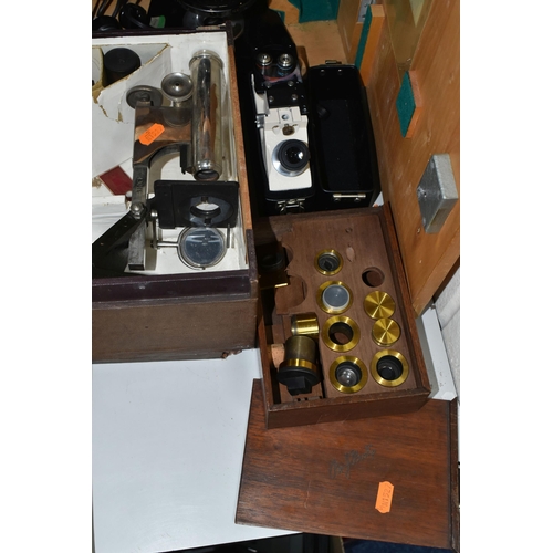 477 - FOUR VINTAGE MICROSCOPES, comprising a PZO Warszawa research microscope model MB 8 in a wooden case,... 