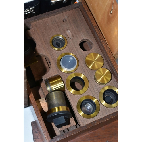 477 - FOUR VINTAGE MICROSCOPES, comprising a PZO Warszawa research microscope model MB 8 in a wooden case,... 