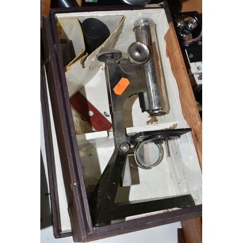 477 - FOUR VINTAGE MICROSCOPES, comprising a PZO Warszawa research microscope model MB 8 in a wooden case,... 