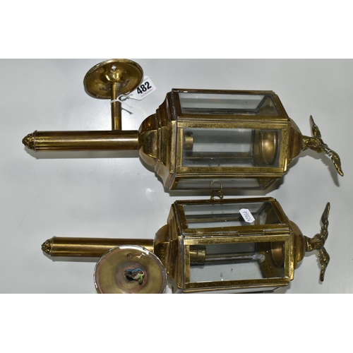 482 - A PAIR OF BRASS ELECTRIC WALL LIGHTS, in the style of Victorian coach/carriage lanterns with brass e... 