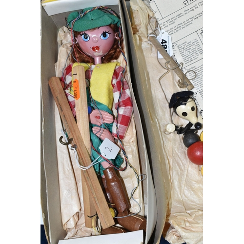 489 - A BOXED PELHAM PUPPET COWGIRL, AND A SMALL MICKEY MOUSE STRING PUPPET, both of painted wood construc... 