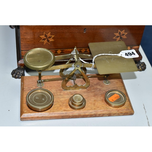 494 - A TEA CADDY, A WOODEN BOX AND A SET OF POSTAL SCALES, comprising a bombe tea caddy with internal div... 