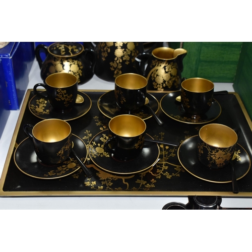 578 - A CHINESE LACQUER WARE TEASET, comprising of a tray, six cups, saucers and spoons, teapot, milk jug ... 