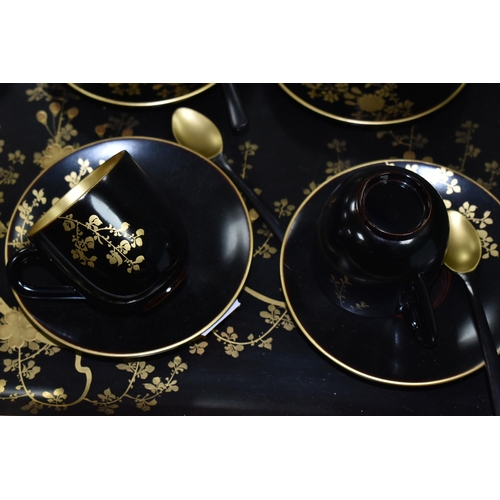 578 - A CHINESE LACQUER WARE TEASET, comprising of a tray, six cups, saucers and spoons, teapot, milk jug ... 