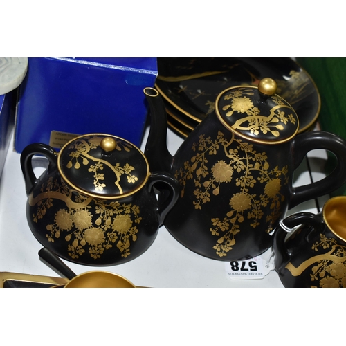 578 - A CHINESE LACQUER WARE TEASET, comprising of a tray, six cups, saucers and spoons, teapot, milk jug ... 