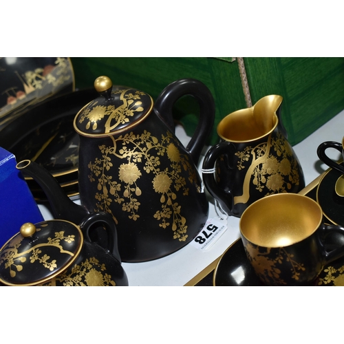 578 - A CHINESE LACQUER WARE TEASET, comprising of a tray, six cups, saucers and spoons, teapot, milk jug ... 