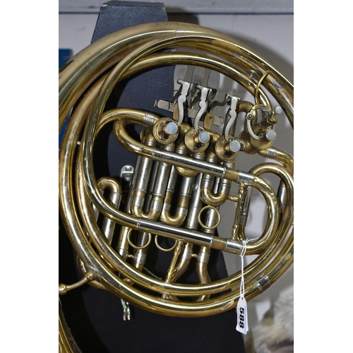 588 - A FRENCH HORN AND CASE, made in Italy stamped 8970, gold lacquered, two mouth pieces, with a lockabl... 