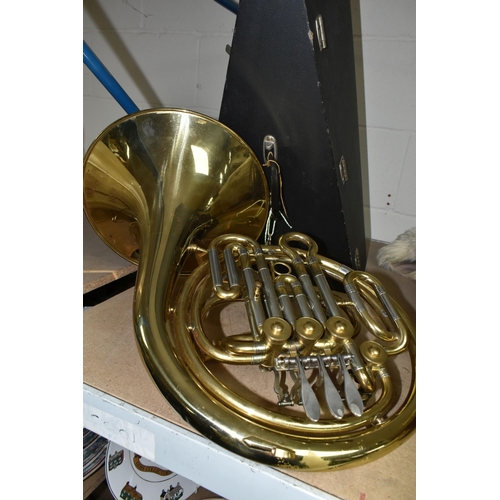 588 - A FRENCH HORN AND CASE, made in Italy stamped 8970, gold lacquered, two mouth pieces, with a lockabl... 