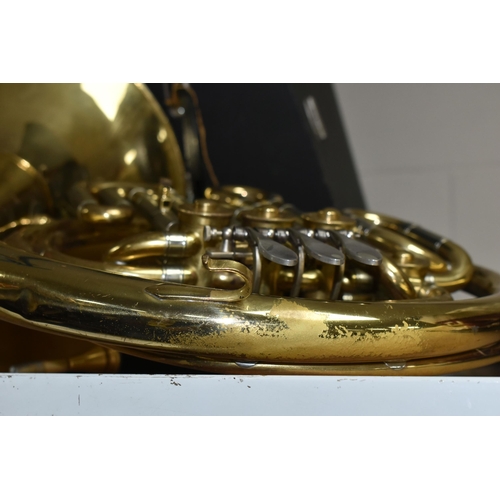 588 - A FRENCH HORN AND CASE, made in Italy stamped 8970, gold lacquered, two mouth pieces, with a lockabl... 