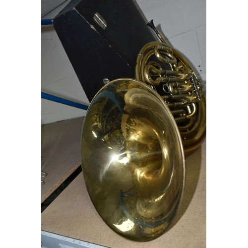 588 - A FRENCH HORN AND CASE, made in Italy stamped 8970, gold lacquered, two mouth pieces, with a lockabl... 