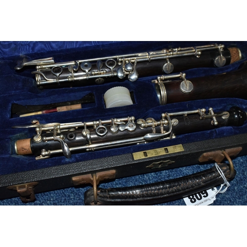 608 - TWO CASED WOODWIND INSTRUMENTS: AN OBOE BY F. LORÉE OF PARIS, AND A CLARINET, the oboe stamped 'F. L... 