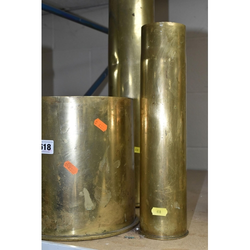 618 - FOUR BRASS SHELL CASES, comprising a German 8.5 inch case dated 1917, a German 4 inch case and two B... 