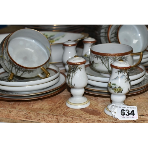 634 - A JAPANESE DINNER SERVICE, comprising seven cups, eight saucers and side plates, twelve dinner plate... 