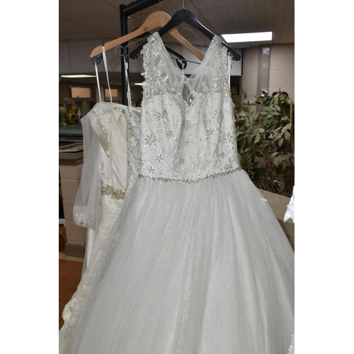 653 - A GROUP OF WEDDING DRESSES, retail stock clearance, assorted styles to include princess line, A line... 