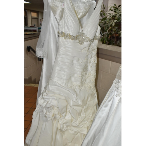 653 - A GROUP OF WEDDING DRESSES, retail stock clearance, assorted styles to include princess line, A line... 