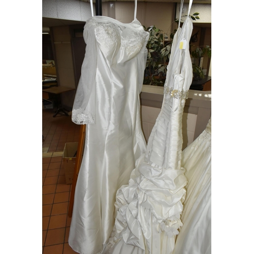 653 - A GROUP OF WEDDING DRESSES, retail stock clearance, assorted styles to include princess line, A line... 