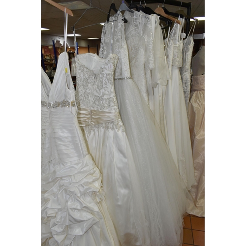 653 - A GROUP OF WEDDING DRESSES, retail stock clearance, assorted styles to include princess line, A line... 