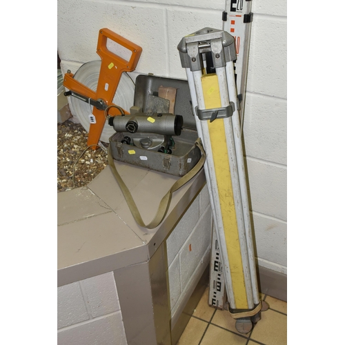 691 - A GROUP OF SURVEYOR'S MEASURING TOOLS, comprising a tripod, measure and Topcon model TS2 No. 5610386... 